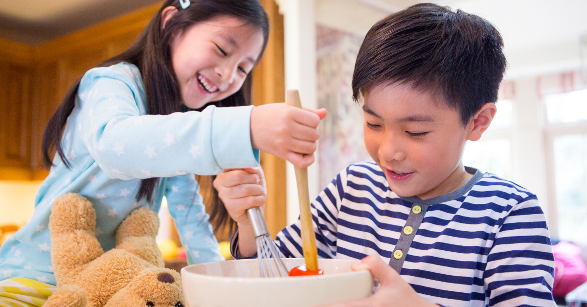 2 children mixing food in bowl