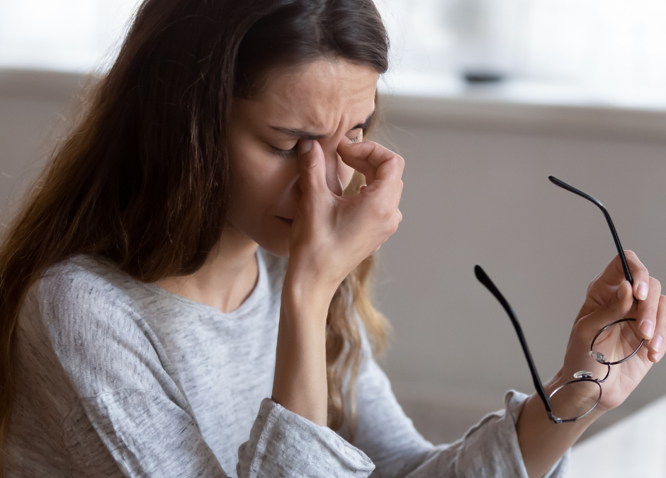 woman rubbing eyes from fatigue