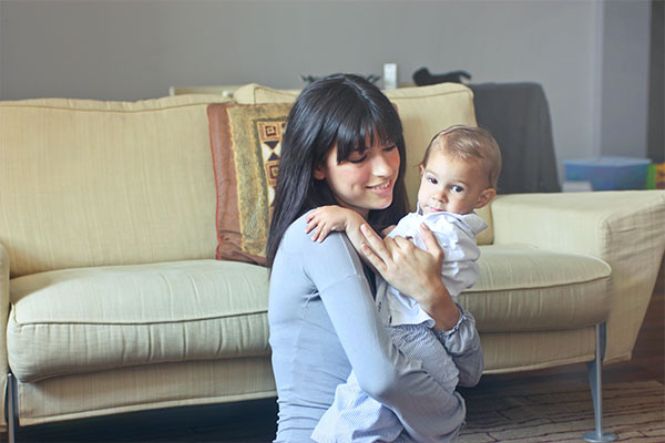 two nannies looking at a computer